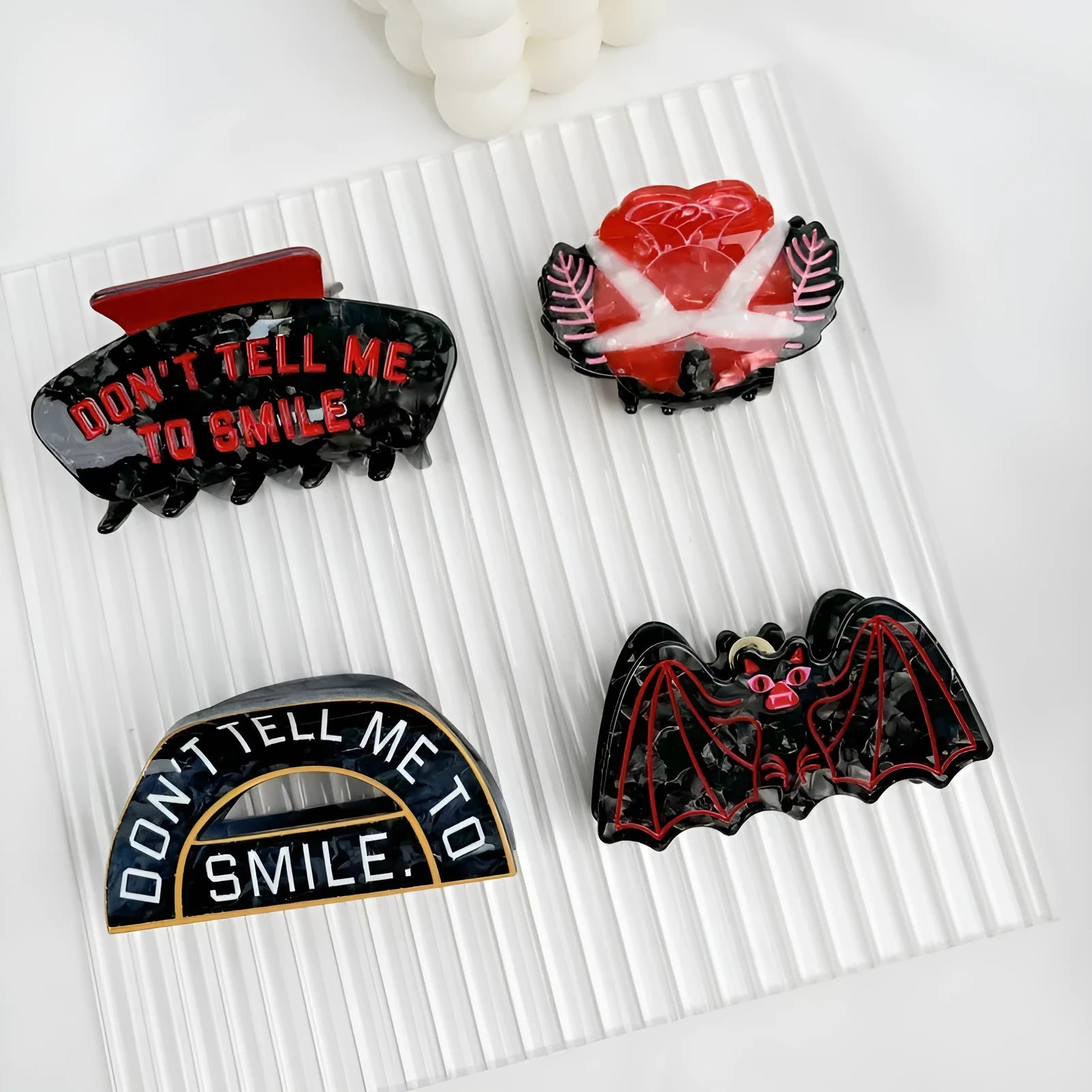 Halloween shark vinegar bat hair clip with bat design elements in four colour options