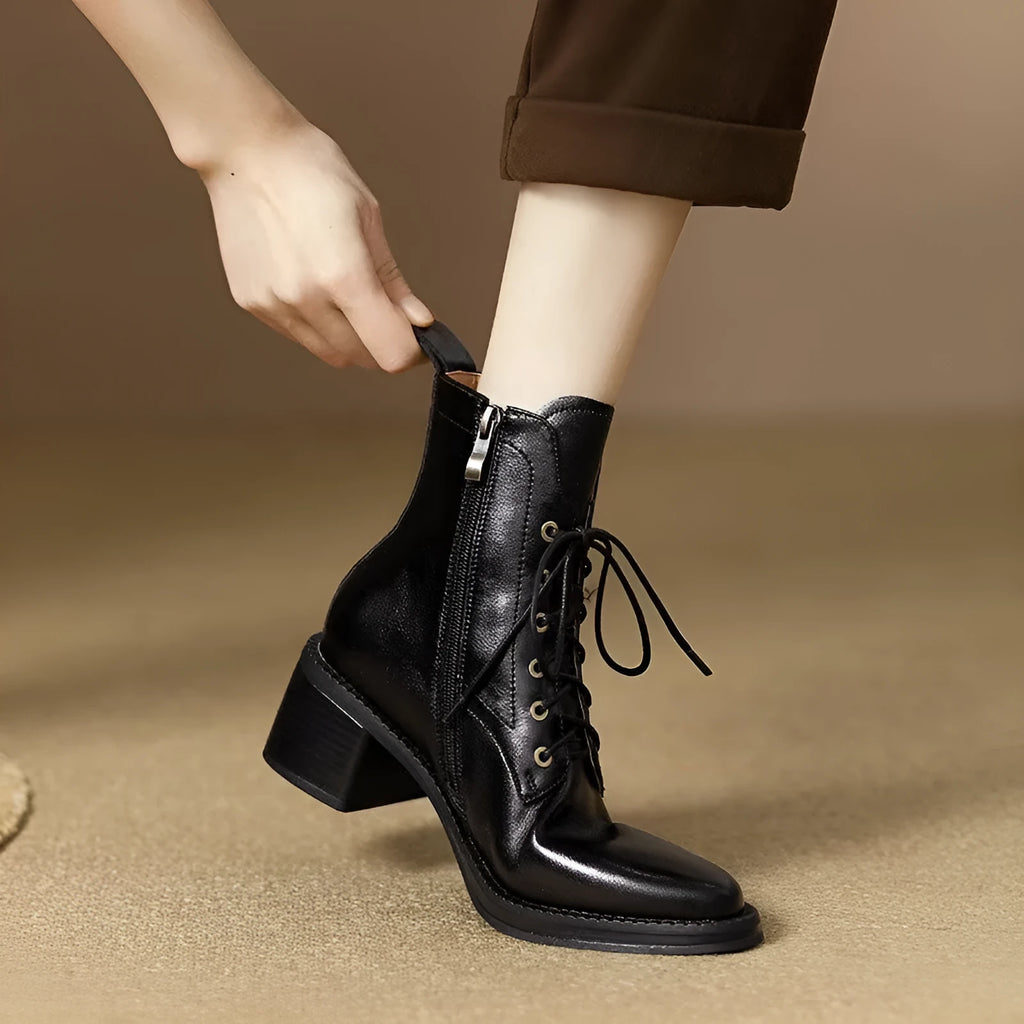 Black pointed-toe women's short tube ankle boots with a 5.5cm heel on a white background.
