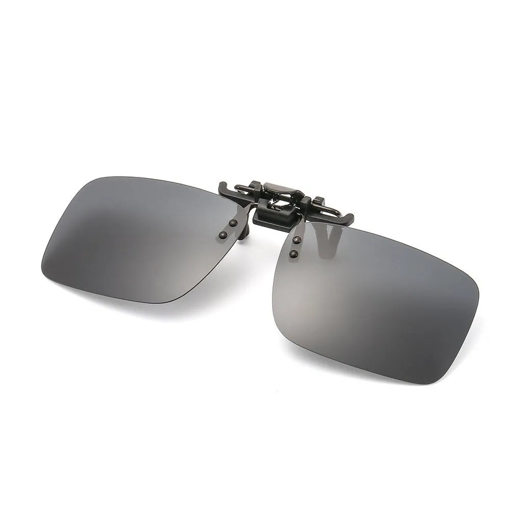 Transparent colourless resin polarised clip-on sunglasses with dual-purpose day and night modes for driving