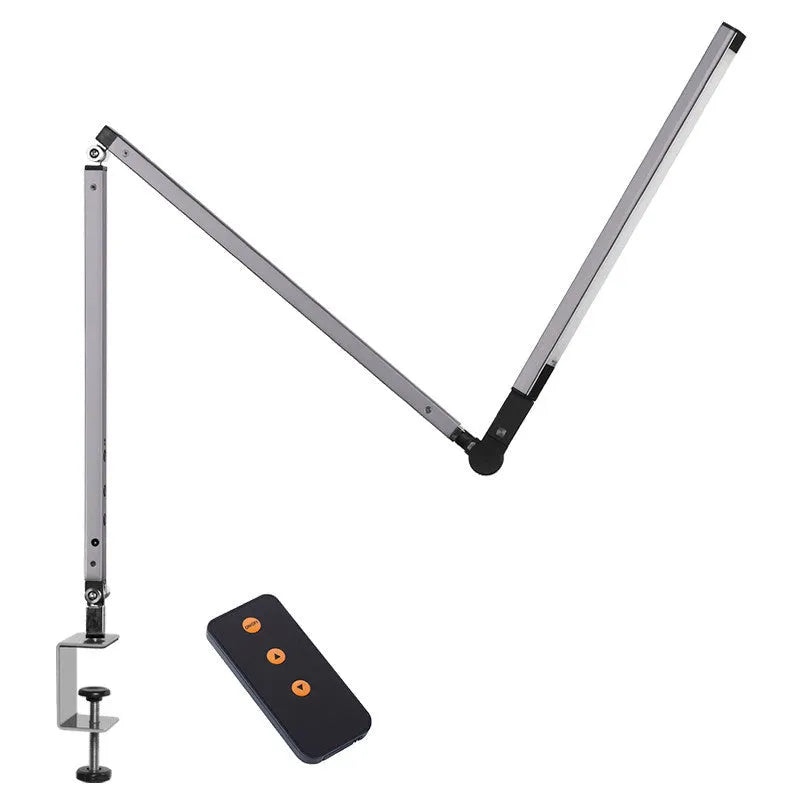 Black clip mount LED desk lamp with dimmer switch attached to study desk edge