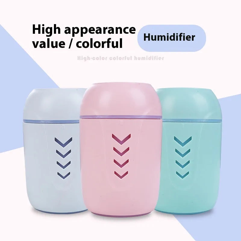Round white portable USB air purifier for car and desktop use on a wooden surface.
