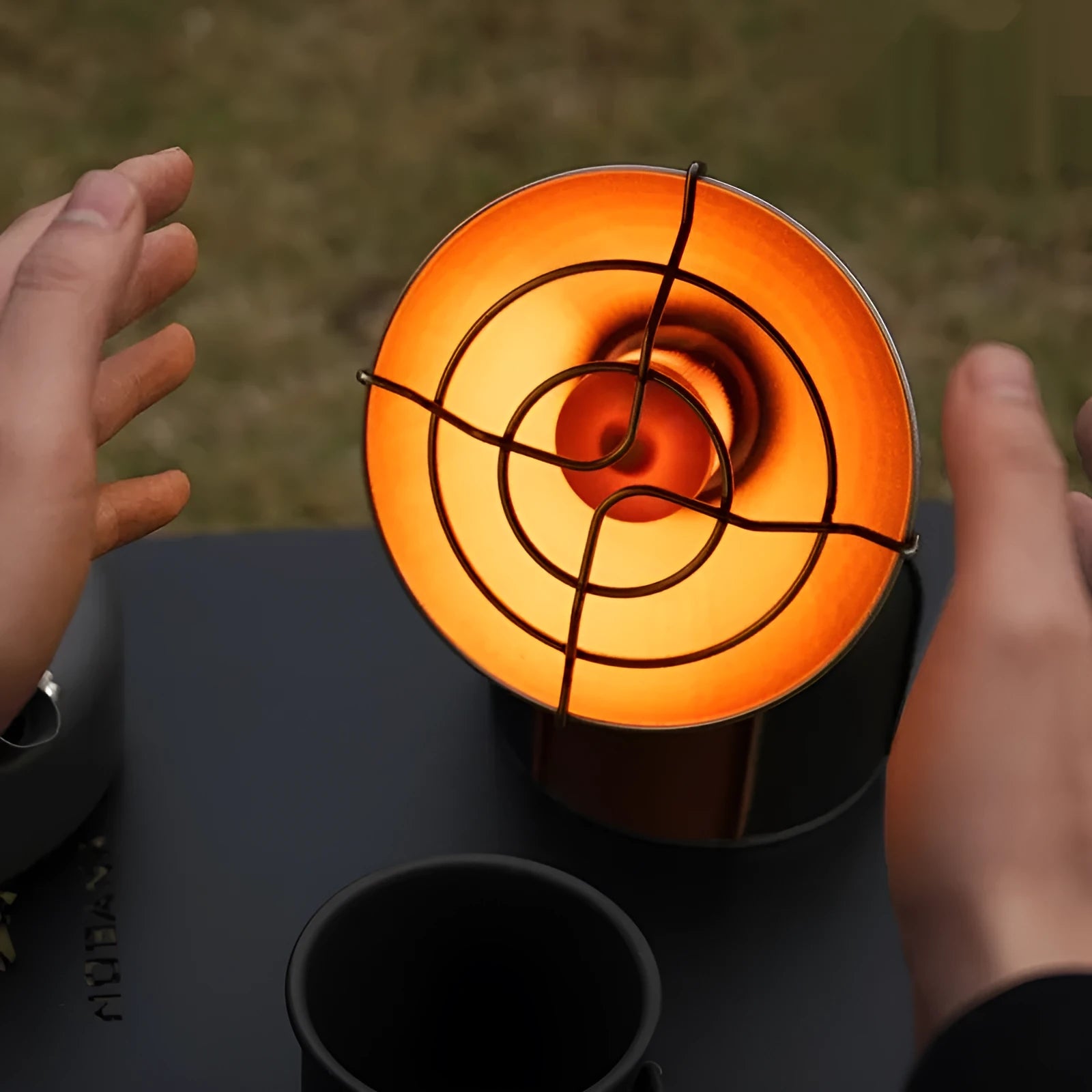 Black and orange portable camping heater stove with automatic ignition system