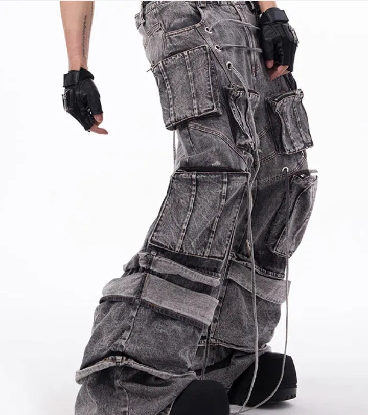 Grey distressed denim overalls with rope stitching and mop pant design