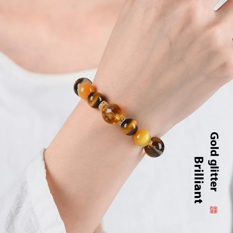 Natural yellow artificial crystal bead bracelet with 10mm tower beads on a string.