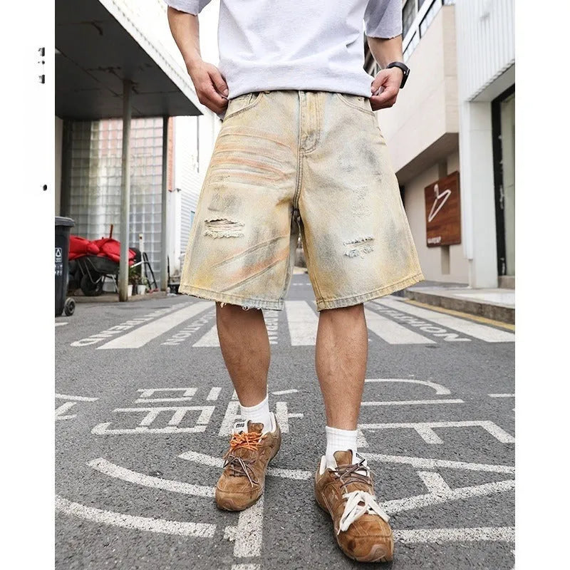 Men's light blue ripped denim shorts with washed old vintage styling