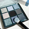 MUGELEEN nine-colour eye shadow palette showing blue smoked colours with matte and shimmer finishes