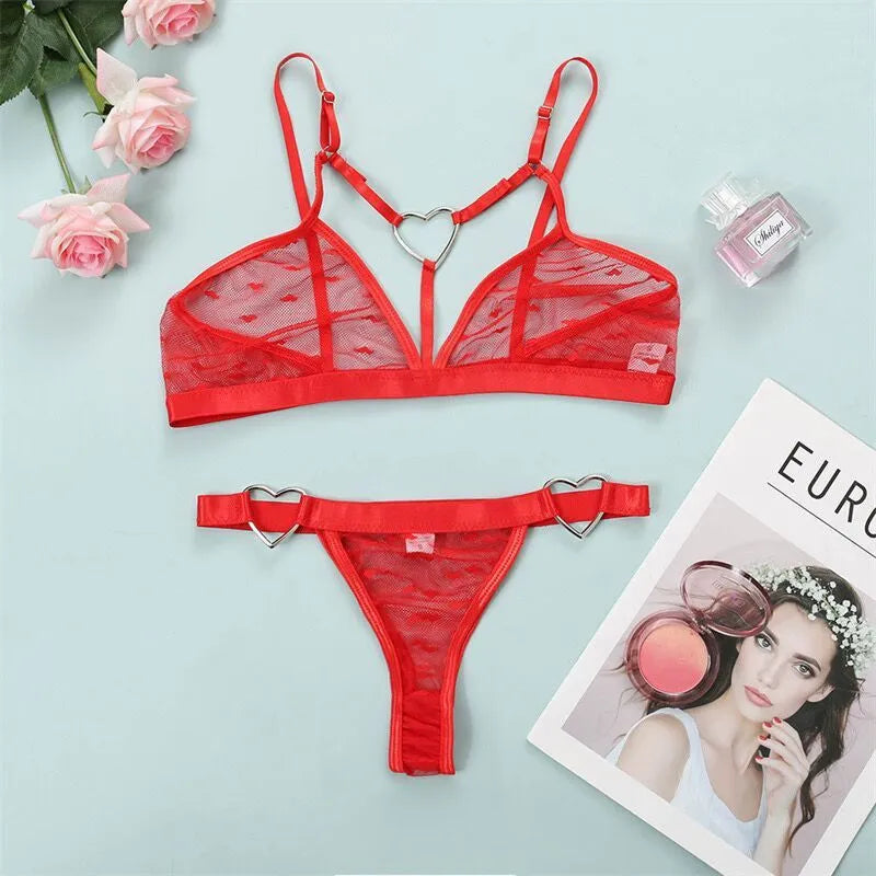 Ladies black mesh three-point design two-piece set with top and trousers on a hanger.