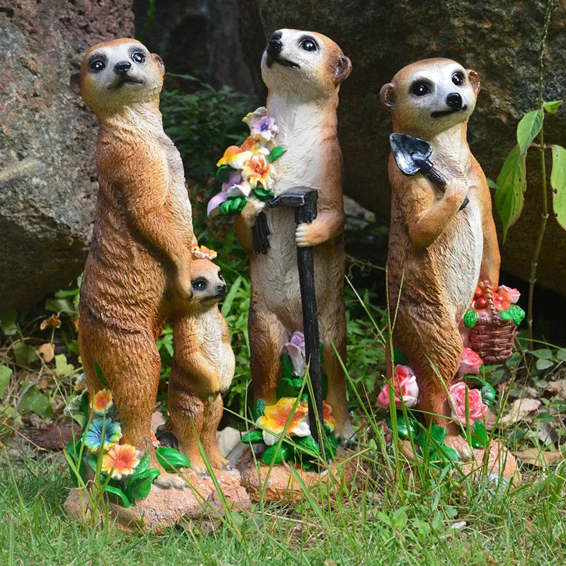 Three straw hat mongoose resin ornaments for garden decoration: mother and son, with rake, and with shovel.