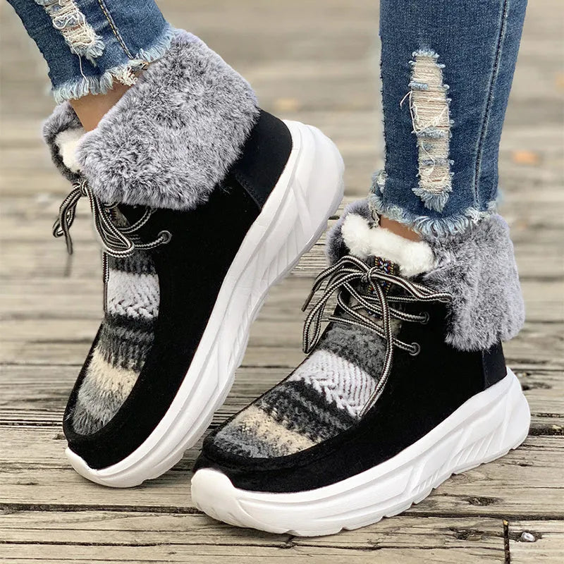 Women's beige lace-up snow boots with fuzzy lining and a thick platform sole on a white background.