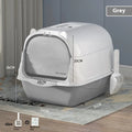 Oversized enclosed PP cat litter box with lid in grey colour, placed on floor
