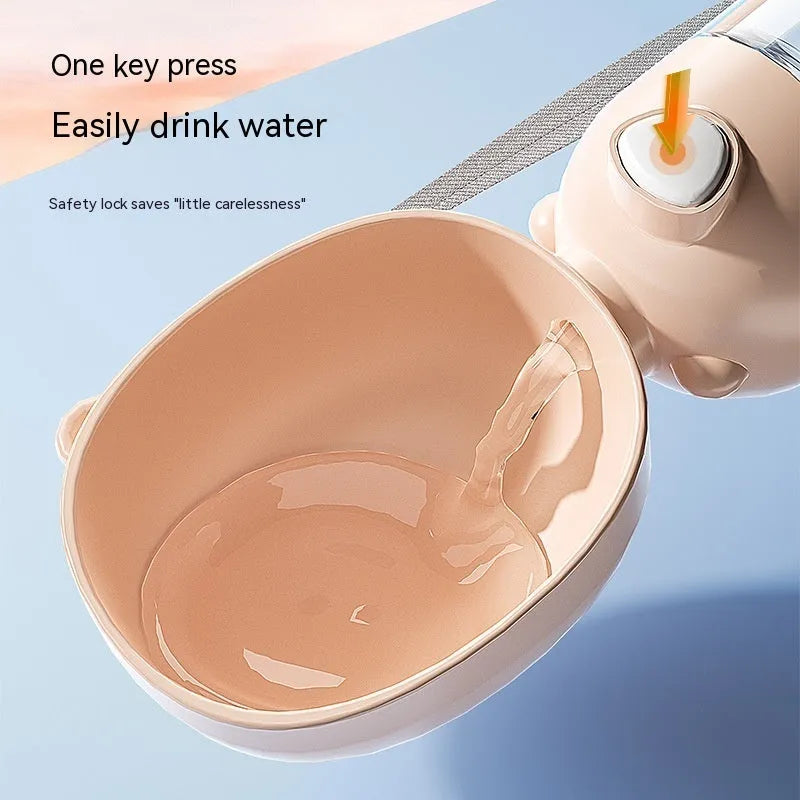 Portable dog water bottle and feeder with attached food container and bowl in yellow, pink, or brown.