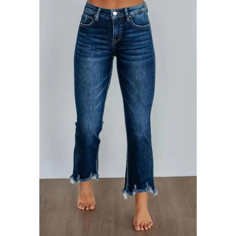 Women's solid dark blue denim casual pants with a hand-worn finish on a hanger.