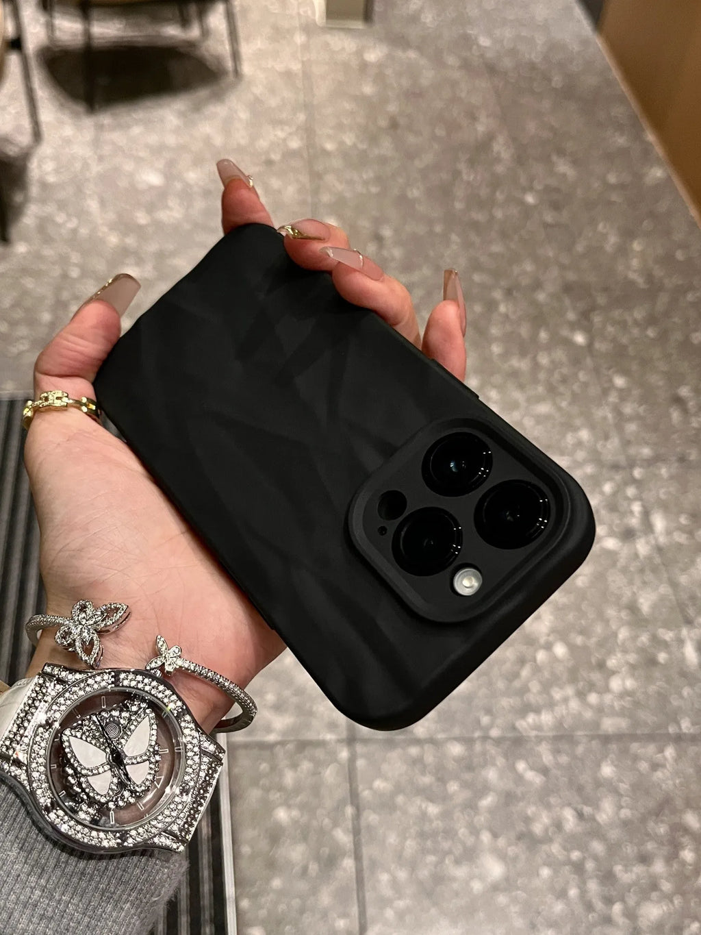 Advanced Skin Wrinkled Silicone Phone Case for iPhone 15 14 13 12 in black with textured wrinkle finish