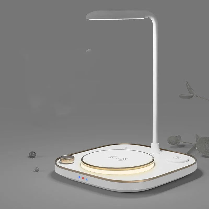 Alpharan three-in-one wireless magnetic charger desk lamp with 15W fast charging in black, showing a phone on the charging base and the lamp on