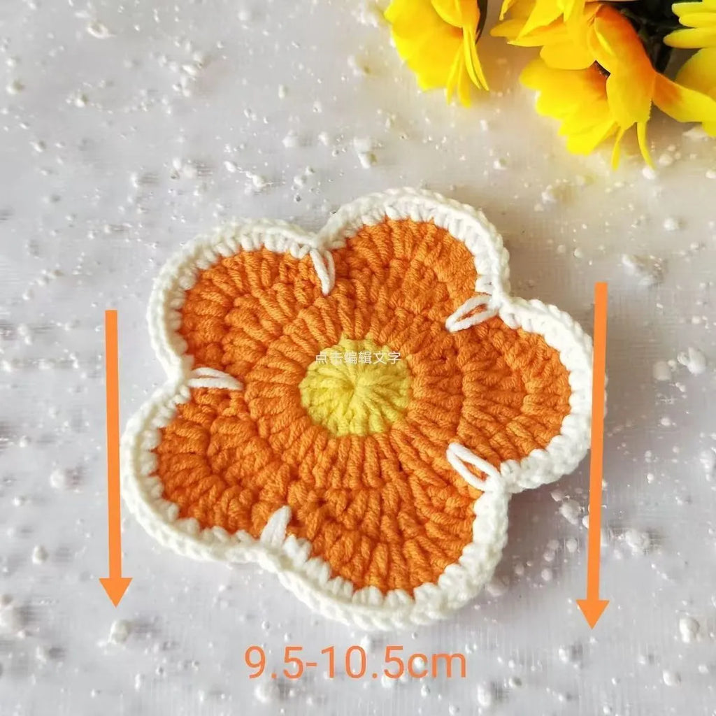 Handmade woven flower placemat set of five round polypropylene table mats in blue, green, orange, pink, and purple.