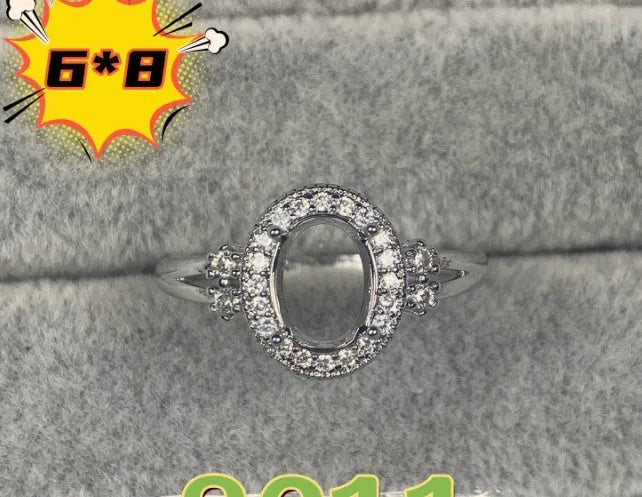 Oval open mouth copper ring with a 6*8 centre stone and five-pointed star ornament detail.