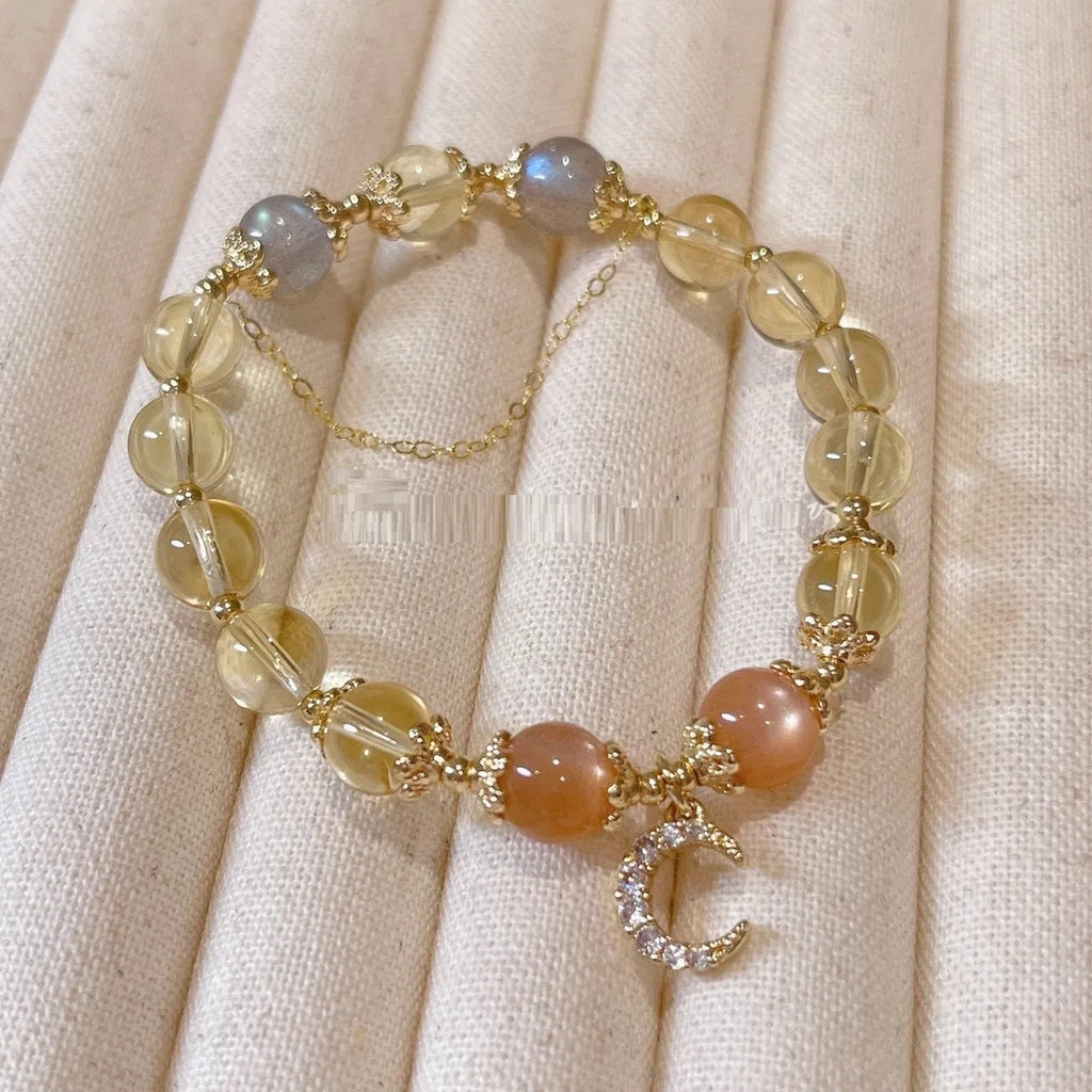 Moonstone crystal bracelet with 14K gold electroplating and diamond-shaped citrine beads on adjustable band