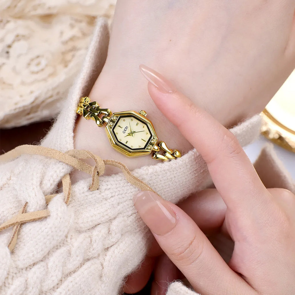 Octagonal women's quartz watch with 7.8mm alloy case, 17.5mm barrel dial, and steel gold finish