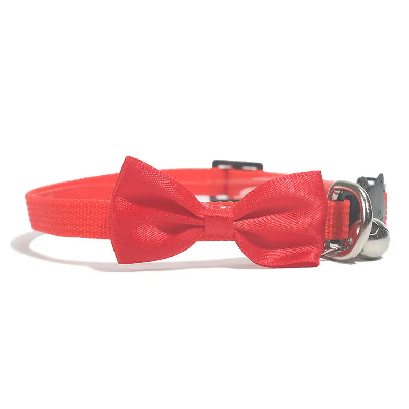 Adjustable nylon cat bow collar with a bell in a striped pattern, shown in a bright colour.