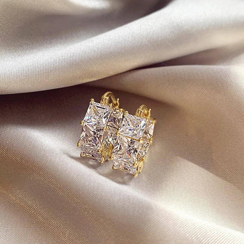 Geometric U-shaped zircon ear rings with gold plating in black, pink and white colour options