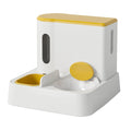 Gray automatic cat feeder and water dispenser integrated double-bowl station on a floor.