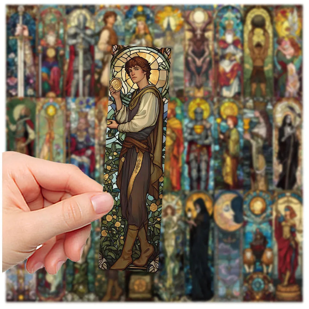 Set of 30 handmade paper tarot bookmarks with painted glass card designs.