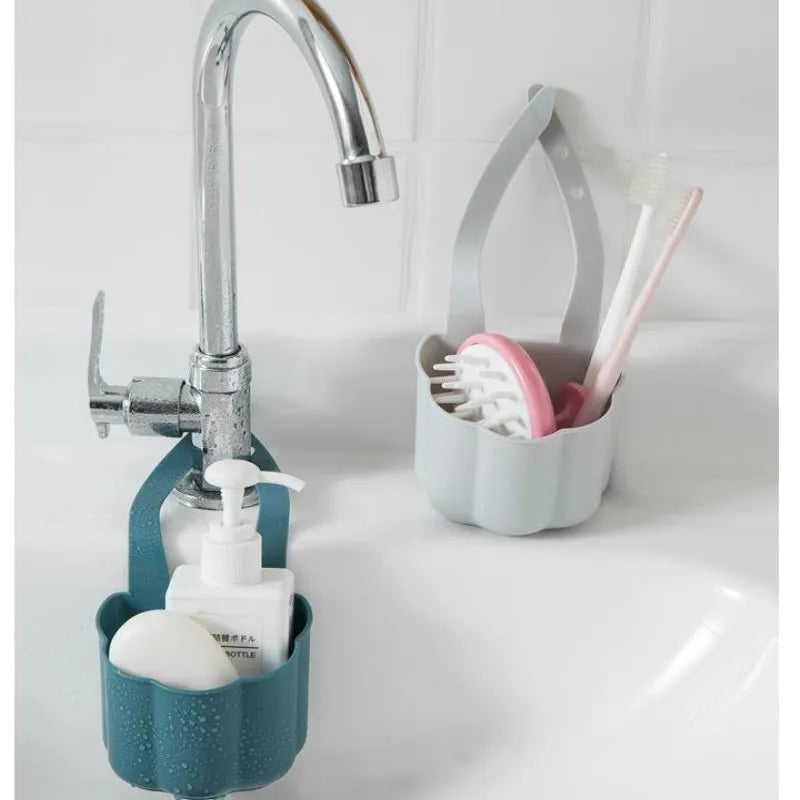 Nordic-style plastic sink drain basket in dark blue on a kitchen countertop.