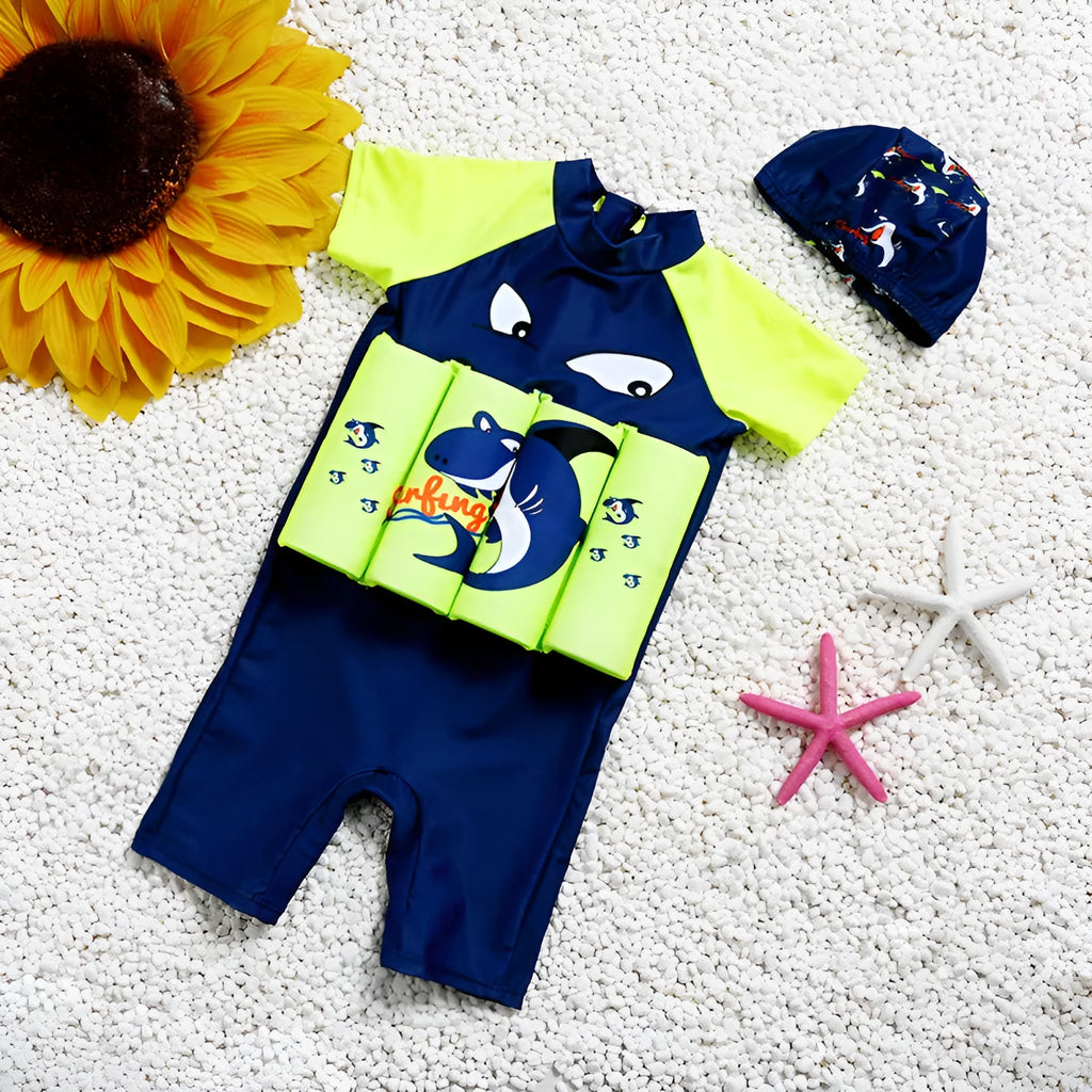 A child's one-piece buoyancy swimsuit with cartoon print, showing sun protection and flotation design.