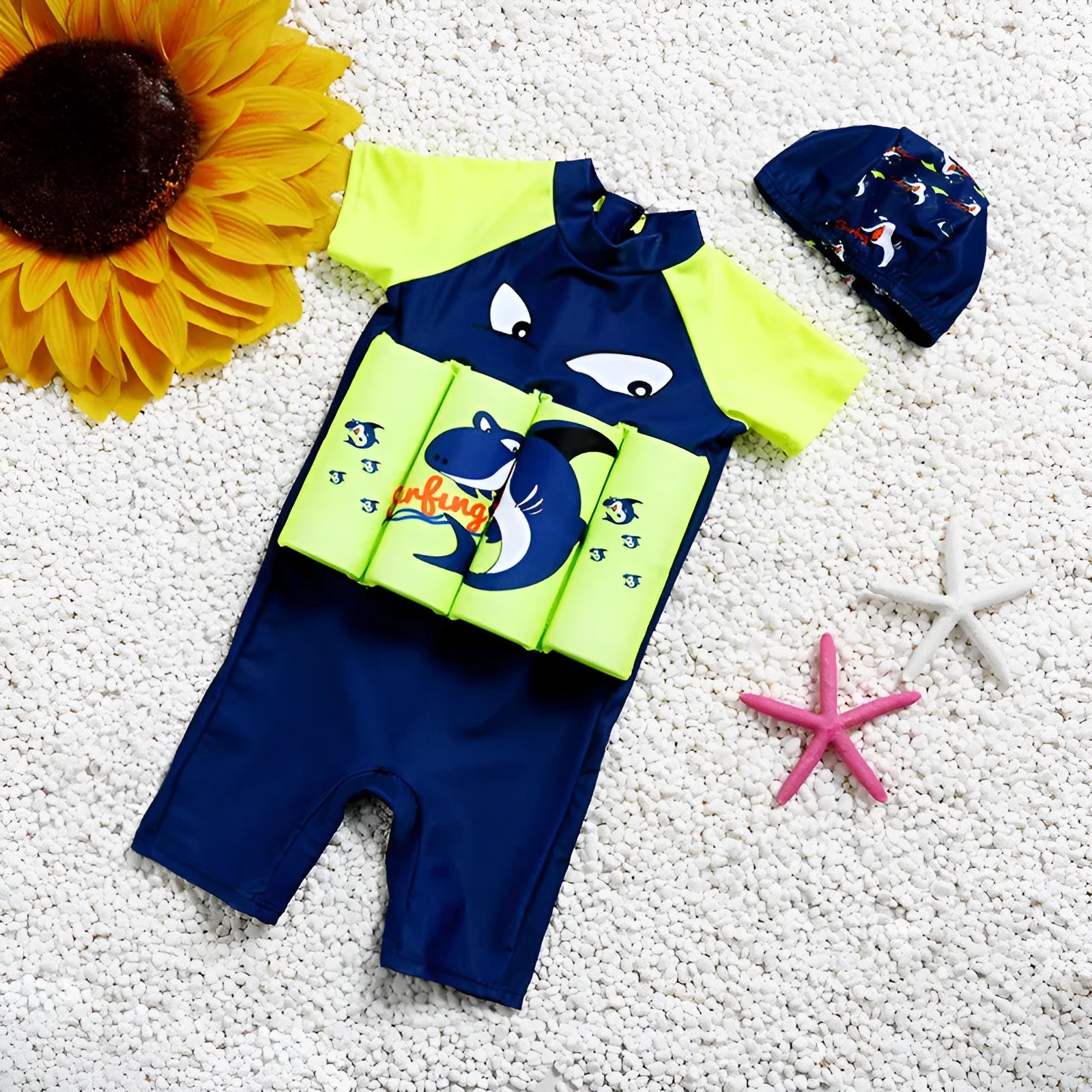 A child's one-piece buoyancy swimsuit with cartoon print, showing sun protection and flotation design.
