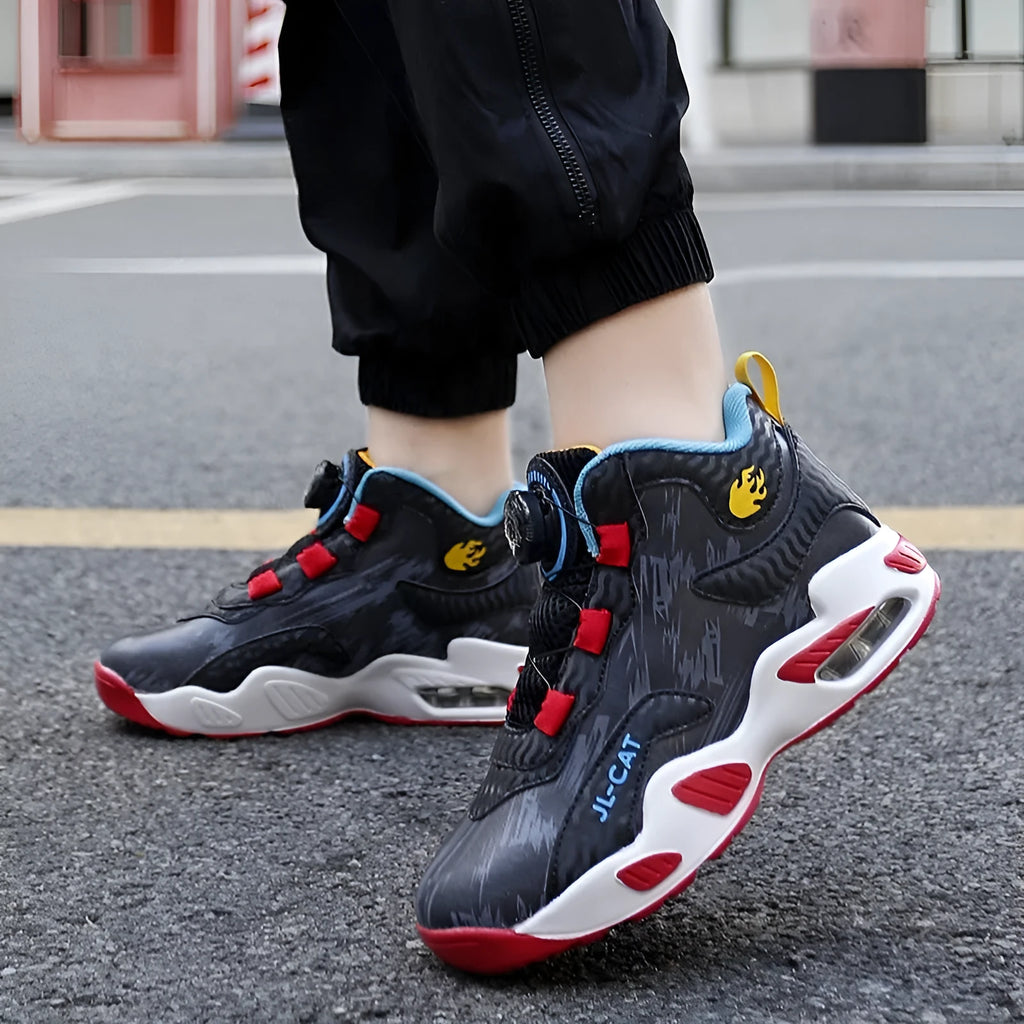 Boys' black basketball shoes with a rotating button closure and a white PU sole.