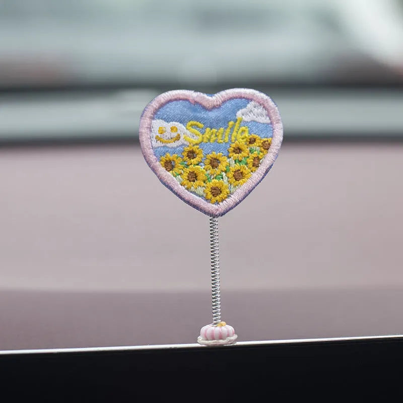 Six yellow PVC duckling car decorations with Hello sign on car dashboard