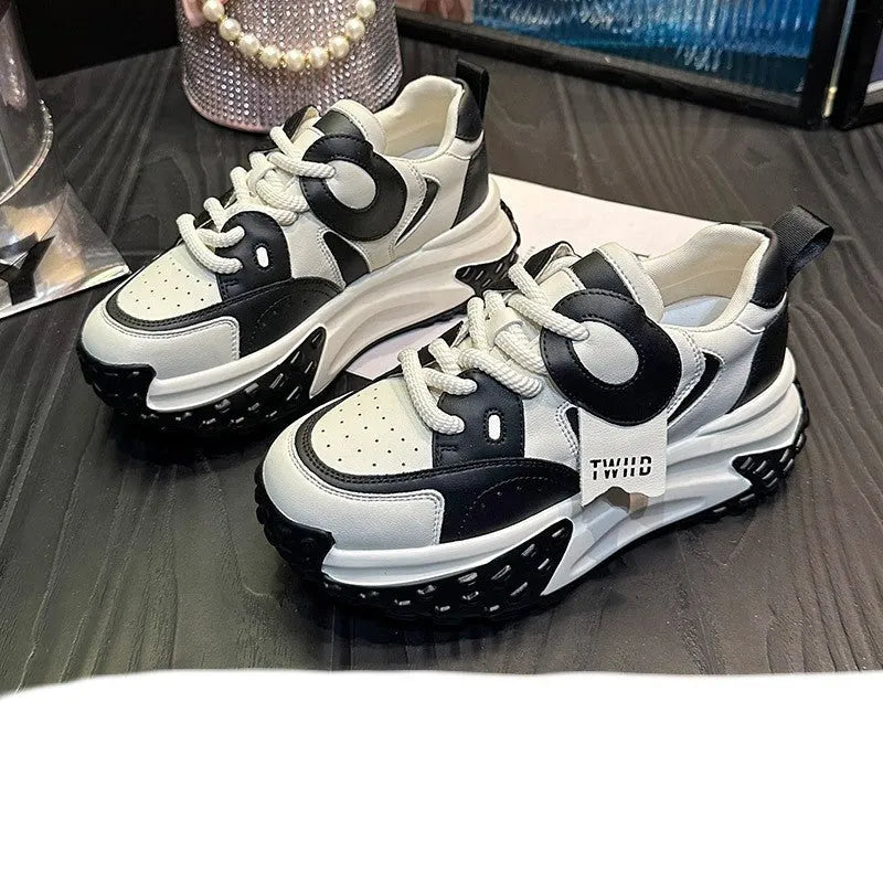 A pair of thick-soled leather sports casual shoes with a wedge heel and lace-up front in a choice of colours.