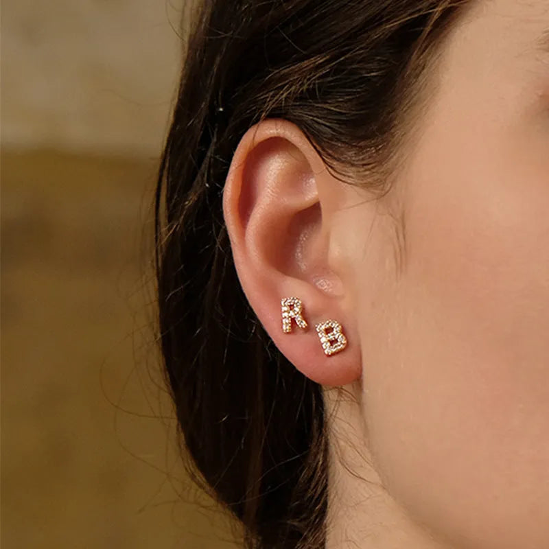 Brass gold plated alphabet letter earrings showing A to Z initial options with diamond treatment on zircon elements