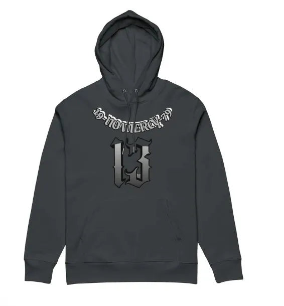 A loose-fitting, hooded pullover sweater with a fleece lining, shown in various colours including white, black, and grey.