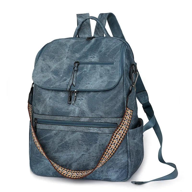 Retro college style PU backpack with curved shoulder straps shown in a solid colour with stitching detail.
