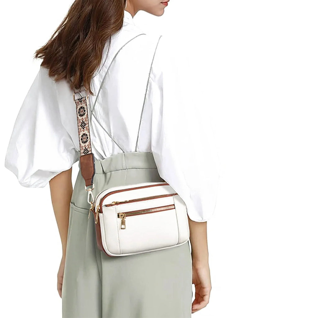 Triple-zipper shoulder bag with floral embroidered straps in colourblock finish for women