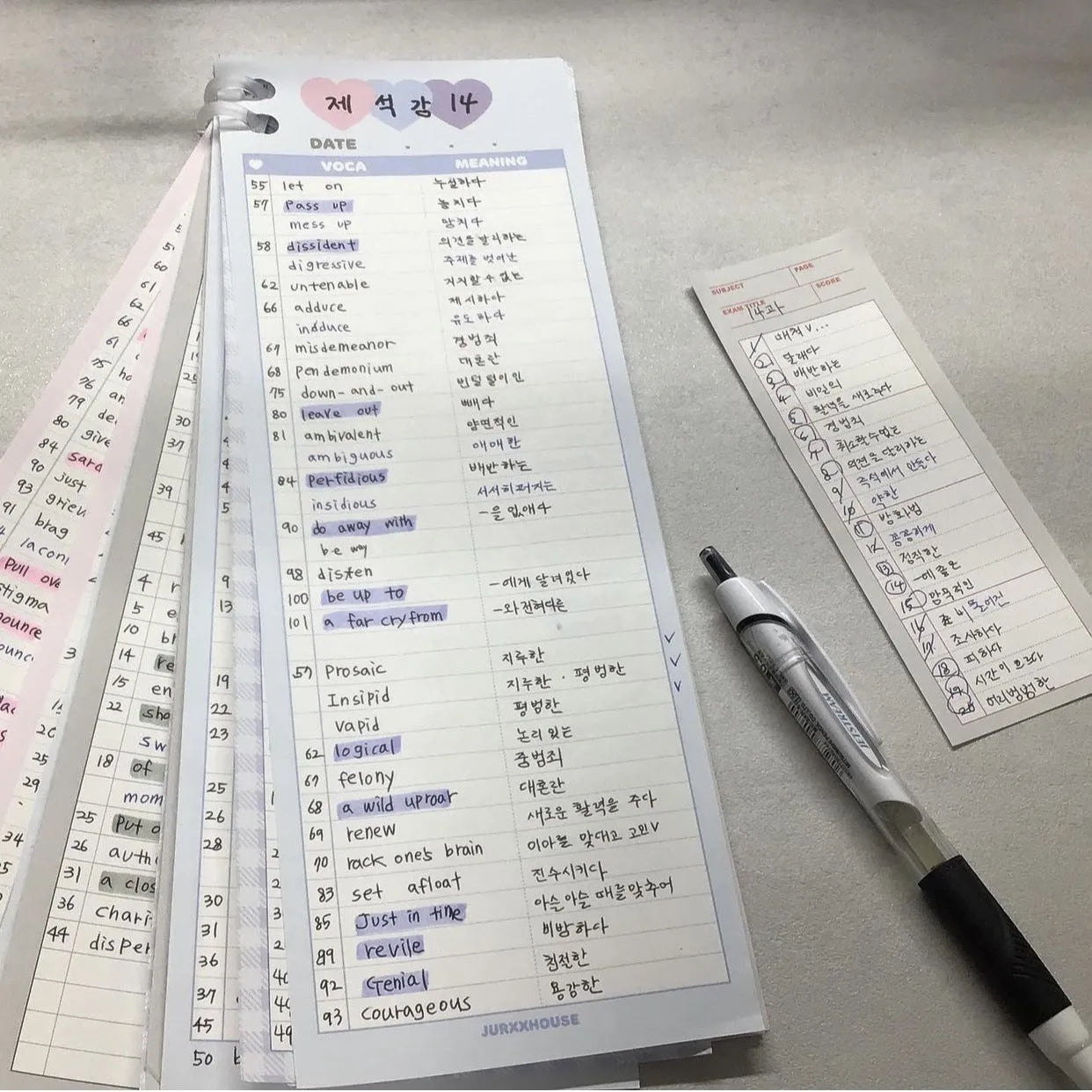 Blue B5 half-size vertical notepad with 30 sheets next to pink and purple versions.