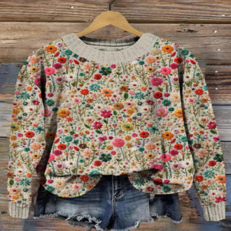 Women's round neck long sleeve sweater with a digital floral print pattern.