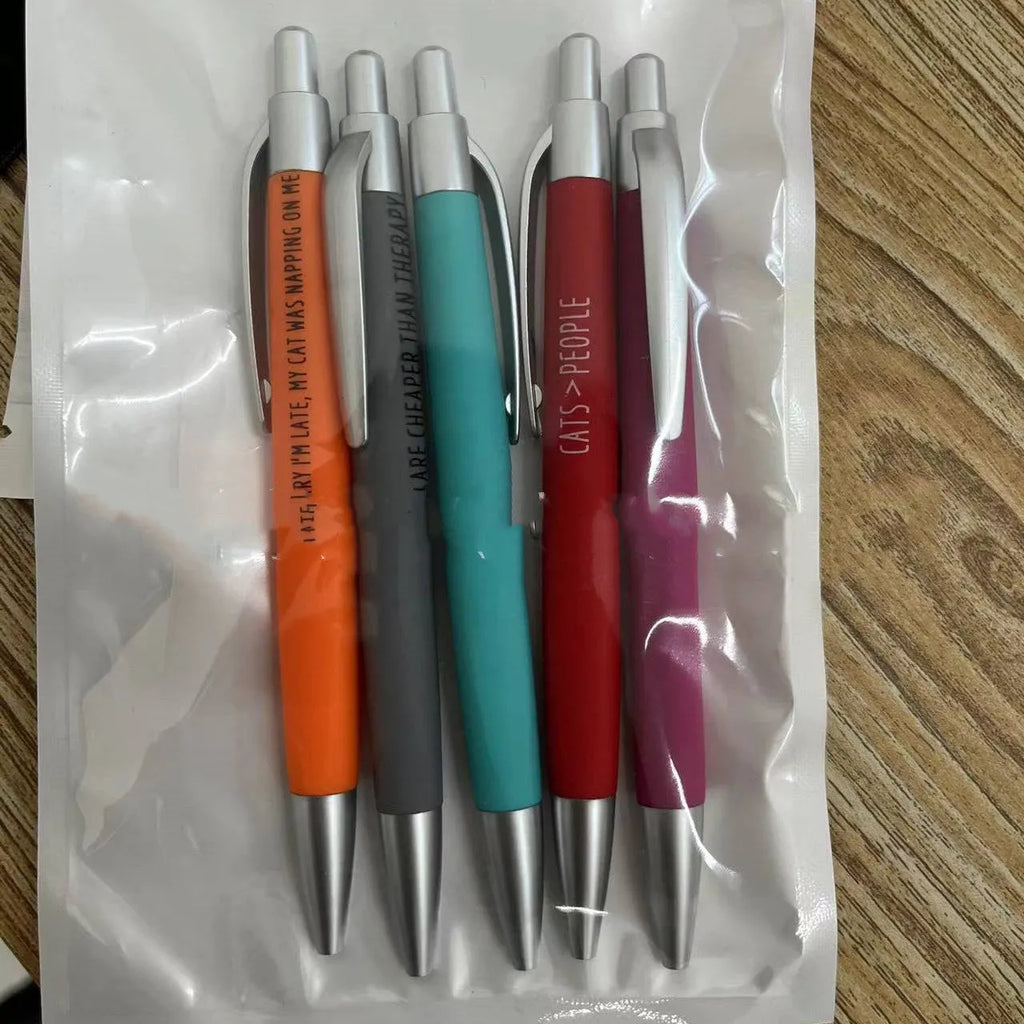 Set of five automatic push-action pens with cat and dog themed refills in a beaded storage bag.