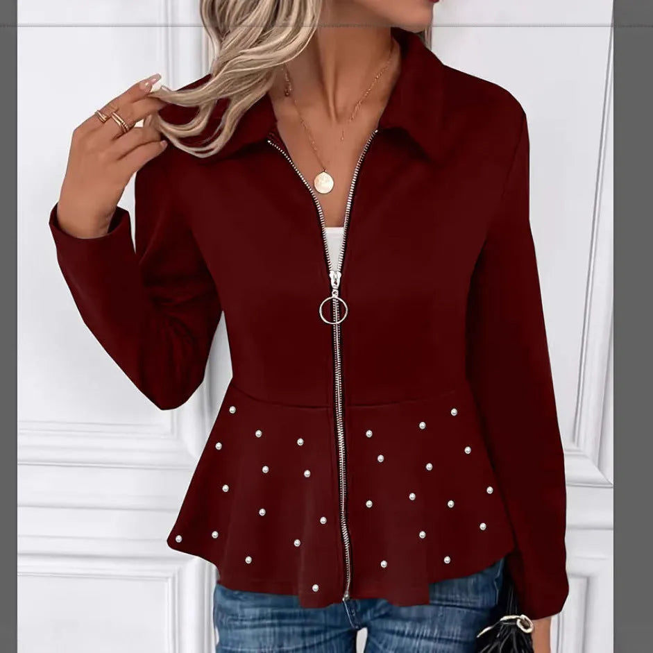 Women's black loose fit coat with a ruffled hem and a heavy-duty front zipper.