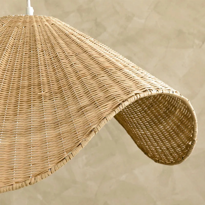 Handmade bamboo and rattan pendant ceiling lamp with a woven willow shade in warm white light.