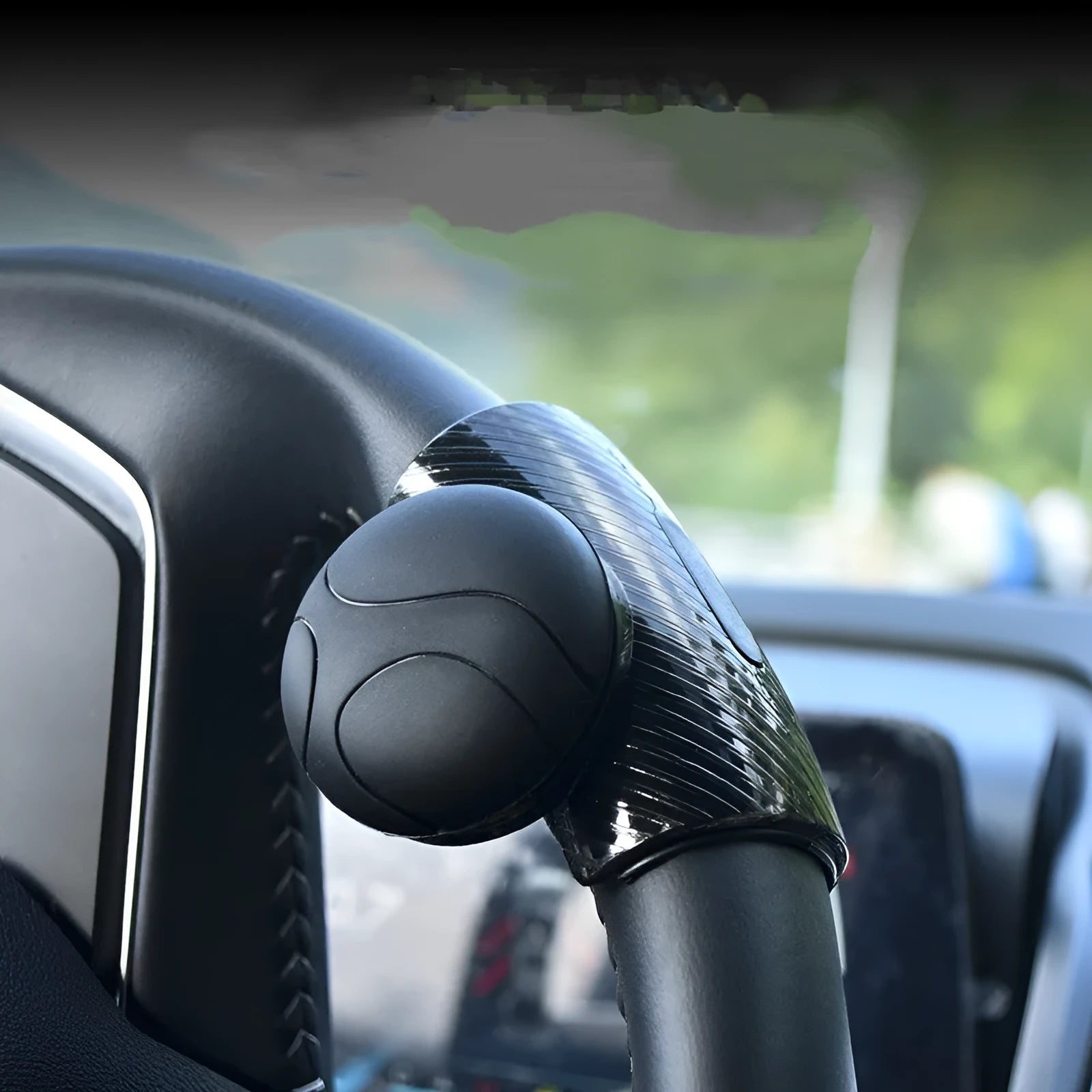 Black and blue silicone steering wheel assist ball with metal bearing for single-hand control