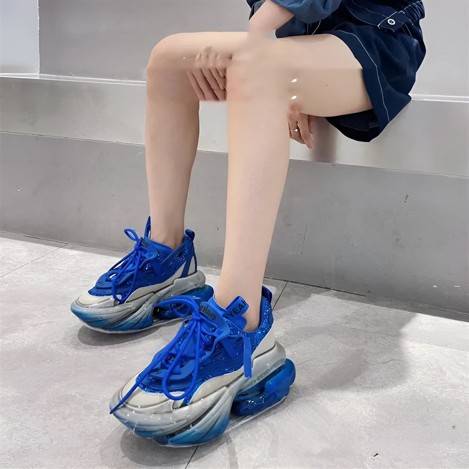 Women's black leather jelly high sports shoes with thick sole and cross-tie laces on a white background.