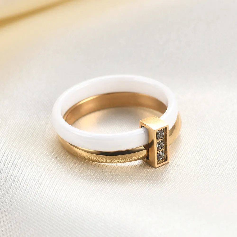 Geometric ceramic women's ring with round zirconium inlay and glossy stitching in steel black or golden white finish
