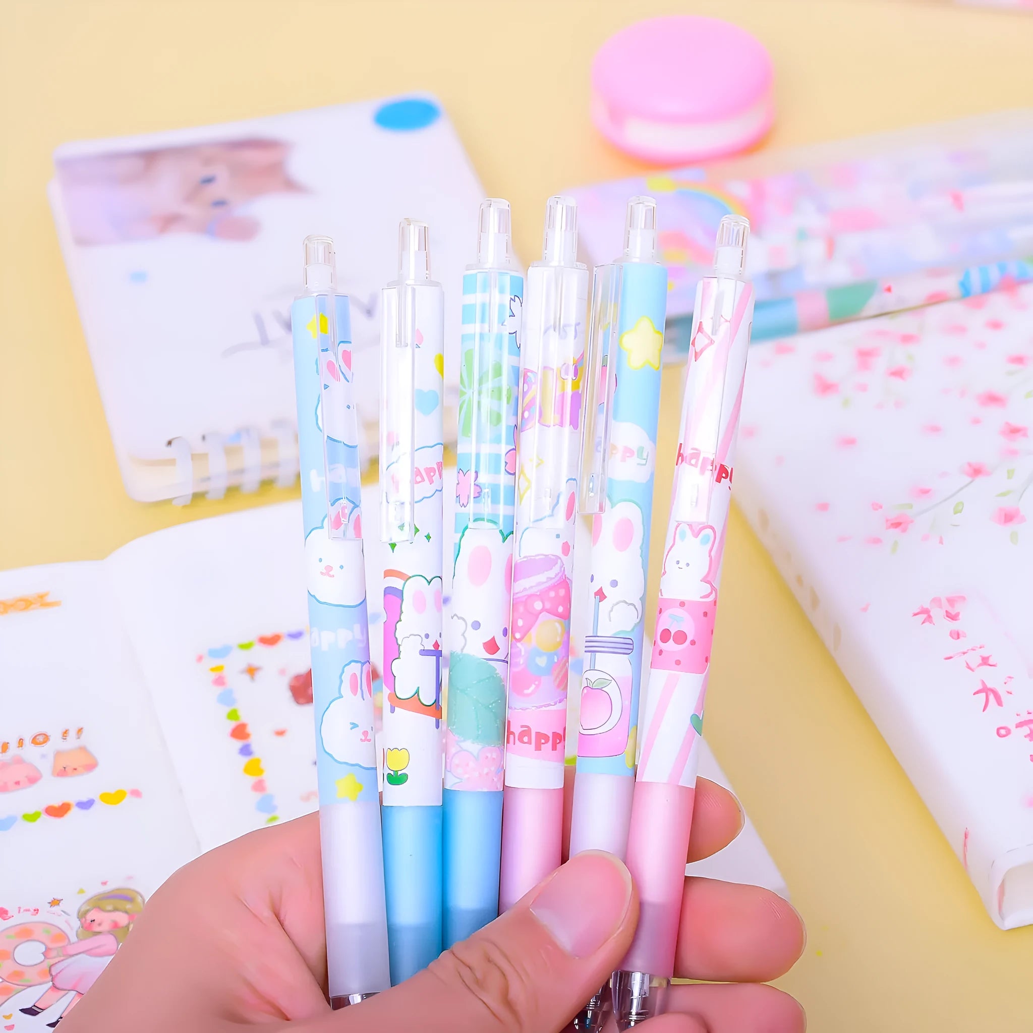 Six cartoon bunny decorated black ballpoint pens with 0.5mm tips on a white background.