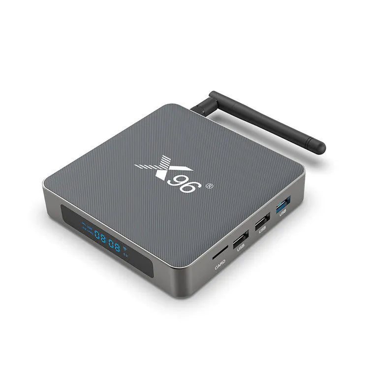Android Smart Voice Set-top Box with remote control, HDMI cable, and power adapter on a table.