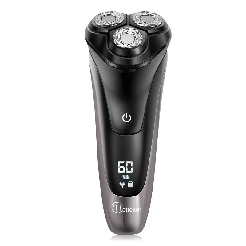 Black electric shaver with three rotating heads, pop-up sideburn trimmer, USB charging cable, and cleaning brush on a grey background.
