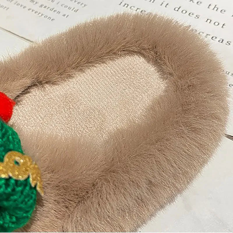 Women's Christmas hat slippers in faux plush with cotton lining and rubber sole.