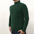 Men's black half-turtleneck zip sweater with long sleeves, shown on a model.