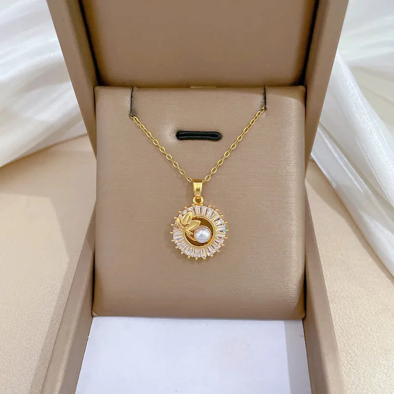 Geometric fashion jewellery set with gold plated copper detailing on titanium steel chain